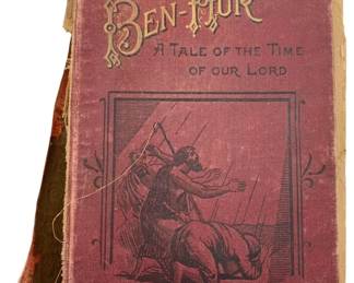 142 - Ant. Hardcover Ben-Hur A Tale of Christ (Description): Antique hardcover edition of Ben-Hur: A Tale of Christ by Lew Wallace. This classic novel features a decorative cloth binding in deep burgundy with gilt lettering and an illustrated cover depicting a scene from the story. The book is in rough shape overall, showing significant wear to the spine and covers consistent with its age and use.