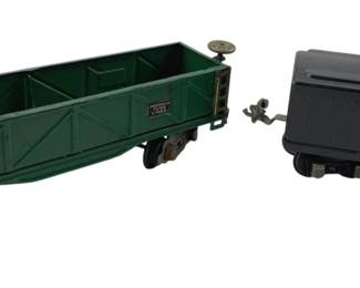 368 - Group of 2 Lionel Lines Train Cars 3"x10"x3" (Description): Group of two Lionel Lines train cars. The set includes a green open gondola car marked American Flyer Lines and a black Lionel Lines tender car. Measures 3 inches by 10 inches by 3 inches.