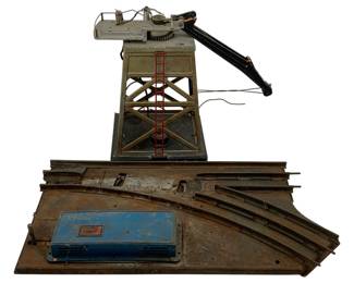 1014 - 2pc Lot O Scale Metal Train Items (Description): A two-piece lot of O scale metal train items. This lot includes model railroad accessories constructed of metal, suitable for O gauge train layouts.