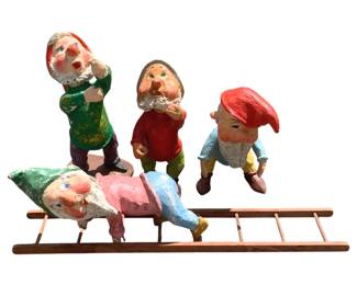 502 - 4pc. Lot Paper Mache Dwarves 26"x15"x16" (Description): A four-piece lot of paper mache dwarves. These colorful hand-crafted figures depict whimsical dwarf characters in various poses. Measures 26 inches by 15 inches by 16 inches.