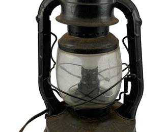 982 - Dietz #2 D-Lite Electrified Lantern (Description): Dietz #2 D-Lite lantern that has been electrified for modern use. This vintage kerosene-style lantern features the classic Dietz design with a glass globe and metal frame. Measures 14.5" x 8".