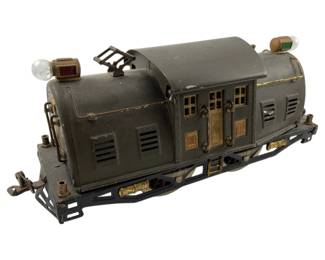 705 - Lionel Super Motor Locomotive 5.5"x12"x4" (Description): Lionel Super Motor locomotive. This vintage model train engine features the classic Lionel design with detailed construction. Measures 5 1/2" x 12" x 4".