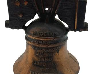 373 - Liberty Bell Cast Iron Bank Copyright 1905 (Description): Liberty Bell cast iron bank with copyright date 1905. This decorative coin bank features the iconic Liberty Bell design with raised text. Measures 4" x 4" x 3".