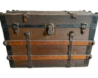 158 - Vintage Wood & Metal Steamer Trunk w/Tray (Description): Vintage wood and metal steamer trunk with insert. This flat-top trunk features a brown canvas-covered body with wooden slat reinforcement, metal corner brackets, and metal banding. The hardware includes a center lock plate, side latches, and leather strap handles. The trunk retains its original interior insert tray. Shows age-appropriate wear and patina consistent with antique use. Measures 22 inches wide by 33 inches long by