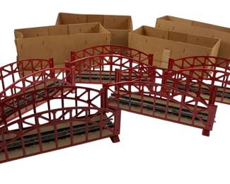 358 - Group of 5 Marklin Red Train Bridges (Description): Group of five Marklin train bridges in red. Each bridge measures 3 inches by 7 inches by 2.5 inches.