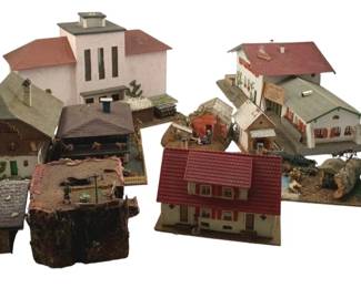 382 - Group Lot of Model Train Display Houses (Description): A group lot of model train display houses with a church. This collection includes various miniature buildings suitable for model train layouts and dioramas.