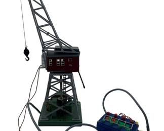246 - Vtg Marklin 7051 HO Remote Control Crane (Description): Vintage Marklin 7051 HO scale remote control rotary crane, made in West Germany. This classic model railroad accessory features a rotating cab and operational crane arm controlled by the included remote unit. Measures 13 inches tall. Used as is electric/electronic/mechanical item. No guarantee all components, untested.