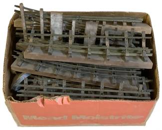 1028 - Box Lot O Scale Train Tracks - Damaged (Description): A box lot of O scale train tracks in damaged condition. The lot includes various track sections suitable for model railroad enthusiasts or restoration projects.