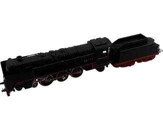 1195 - Lionel HO Scale Steam Locomotive & Tender (Description): Lionel HO scale steam locomotive with accompanying tender car. The locomotive features a classic black body with red accents on the undercarriage and wheels, detailed with a traditional steam engine design including visible wheel linkage mechanisms. The tender car displays a coal load. Measures 1.5" in height.