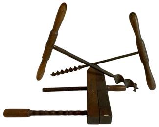 1067 - 3pc. Lot Antique Tools 21"x9" (Description): A three-piece lot of antique tools featuring wooden handles. The collection includes hand drills and a wood clamp with threaded screws. Measures 21 inches by 9 inches.