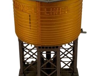 972 - Lionel Water Tower 10"x7" (Description): Lionel Lines water tower model railroad accessory. This classic train layout piece features a detailed tank structure on a lattice support base. Measures 10 inches by 7 inches.
