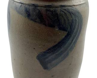 89 - Ant. Salt Glazed Stoneware Crock w/ Cobalt (Description): Antique salt glazed stoneware crock featuring a hand-painted cobalt blue decorative swirl design on a gray-brown body. The crock has a classic cylindrical form with a rolled rim, typical of 19th century American utilitarian pottery. Measures 8" x 5".