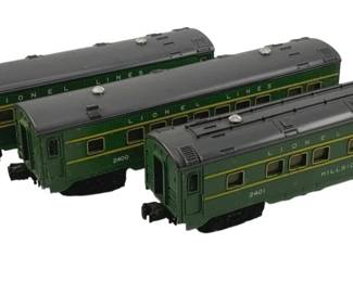 897 - 3pc Set Lionel Lines Passenger Cars O Scale (Description): Three-piece set of Lionel Lines passenger cars in O scale. The set includes cars numbered 2400, 2401 (Hillside), and 2402, featuring a classic green and gray color scheme with yellow accent striping. Each car displays the Lionel Lines name on the roof. Measures 3 inches by 12 inches each.