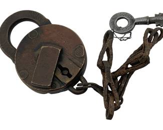 613 - Ames Sword Co. Padlock w/Key 3"x2.75" (Description): Ames Sword Co. padlock with original key attached by chain. The padlock measures 3 inches by 2.75 inches. Features a round body with a hinged shackle and keyhole mechanism.