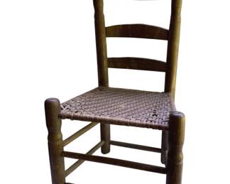 760 - Antique Wood Chair 36"x19"x14" (Description): Antique wood chair featuring a ladder back design with turned finials and a woven seat. The chair measures 36 inches tall by 19 inches wide by 14 inches deep.