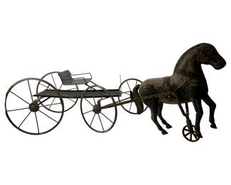 27 - Vtg Metal Horse w/ Carriage Pull Toy (Description): Vintage metal horse with carriage, likely a pull toy. The piece features a painted metal horse mounted on wheels, attached to a four-wheeled open carriage with a bench seat. The surface shows age-appropriate wear with patina and paint loss consistent with antique toys. Measures 11 1/2" x 31" x 11".