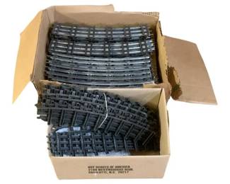 1025 - Box Lot O Scale Train Tracks (Description): A box lot of O scale train tracks. The lot includes an assortment of track sections suitable for O scale model train layouts.