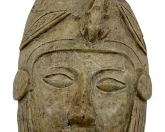 962 - Alabaster Mask Wall Art 3.5"x9.5"x7" (Description): Alabaster mask wall art featuring a carved face with elaborate headdress details. Measures 3.5"x9.5"x7".