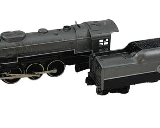 492 - Lionel Locomotive & Coal Car O Scale (Description): Lionel locomotive and coal car in O scale. The set includes a steam locomotive and accompanying coal tender car. Measures 4 inches by 12 inches by 3 inches.