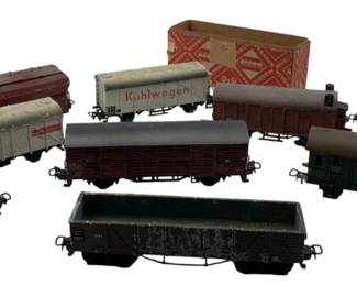 286 - Group Lot of 9 Train Cars 2"x2"x7" (Description): Group lot of 9 train cars. Each car measures approximately 2 inches by 2 inches by 7 inches.