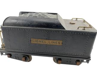 664 - Lionel Lines Coal Train Car 5"x10"x3.5" (Description): Lionel Lines coal train car featuring classic styling. Measures 5 inches by 10 inches by 3.5 inches.