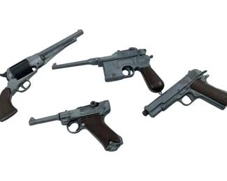 646 - Group Lot of Toy Gun Lighters 5.5" (Description): A group lot of toy gun lighters featuring various replica pistol designs. The collection includes novelty lighters styled after different classic firearm models. Measures 5.5 inches.