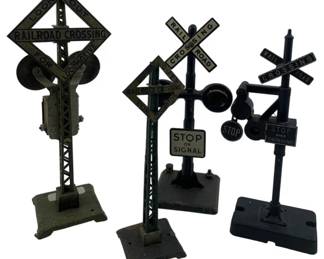 232 - Group Lot of 4 Railroad Crossing Signs 8" (Description): Group lot of four railroad crossing signs. Each sign features classic railroad crossing markings and is mounted on a base. Measures 8 inches in height.