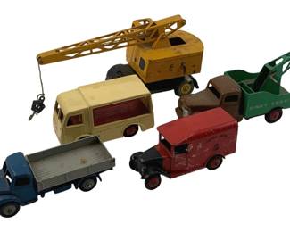 867 - 5pc Dinky Die-Cast Toy Trucks & Corgi Car 3" (Description): Collection of five vintage die-cast toy vehicles including Dinky and Corgi models. The lot features a yellow mobile crane, a green Dinky Service tow truck with brown cab, a blue flatbed truck, a cream and maroon delivery van with hook mechanism, and a red Royal Mail delivery van. All vehicles show age-appropriate play wear consistent with vintage toys. Measures approximately 3 inches.