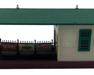 224 - Vtg Lionel Postwar Freight Station Model 356 (Description): Vintage Lionel Postwar Freight Station, likely Model 356. This classic train accessory features the traditional station design with covered platform area and station building. Measures 5 inches by 15 inches by 5 inches.