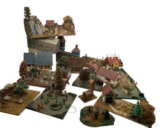 379 - Group Lot Model Train Display Houses (Description): Group lot of model train display houses with graveyard. This collection includes various miniature buildings and scenic elements suitable for model train layouts, featuring detailed architectural structures and a graveyard scene.