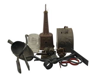 1088 - Lot Antique Metal Diecuts & Hardware (Description): A collection of antique diecuts and assorted hardware pieces. The lot includes a decorative cast iron Tower, a pressed tin bread box or canister lid with floral embossed design, glass globe, various cast iron and metal implements, iron brackets, small mechanical components, and assorted metal hardware pieces. The items show age-appropriate patina consistent with their antique nature.