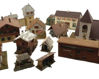 381 - Group Lot of Model Train Display Houses (Description): Group lot of model train display houses. This collection includes various miniature buildings suitable for model train layouts and displays.