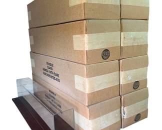 420 - Group Lot of Display Cases for Trains 8 (Description): Group lot of eight display cases designed for trains. Each case measures 8 x 8 x 34 inches. Cases feature a clear acrylic or glass cover with a wood-tone base, suitable for showcasing model trains and related collectibles.