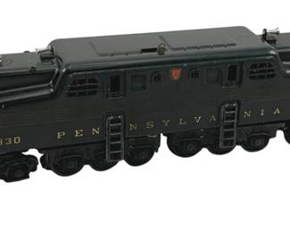 888 - Lionel #2350 Pennsylvania O Scale Locomotive (Description): Lionel #2350 O Scale locomotive in dark green Pennsylvania Railroad livery. This model features the classic GG1 electric locomotive design with gold lettering displaying "Pennsylvania" along the side and the number "2330" on the cab. The engine includes detailed pantographs, handrails, and ladders. Measures 4" x 11.5".