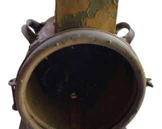 761 - Antique Cannonball Safe 21.5"x16"x12" (Description): Antique cannonball safe featuring a round barrel-style body with side handles and mounted on a metal base plate. This substantial safe measures 21 1/2 inches by 16 inches by 12 inches.