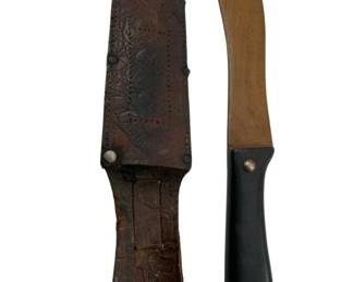 711 - Handmade Wooden Knife w/ Sheath 12" (Description): Handmade wooden knife with leather sheath. The knife features a dark handle with metal rivets. The sheath displays tooled leather work with decorative stitching. Measures 12 inches in length.