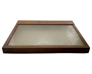 9 - Sheaffer Wooden Display Box 3"x13.75"x9.75" (Description): Sheaffer wooden display box featuring a walnut-toned wood frame with a glass or acrylic top panel. The Sheaffer logo and name are printed on the upper edge of the frame. The box has a low-profile rectangular design suitable for displaying pens or similar collectibles. Measures 3" x 13.75" x 9.75".