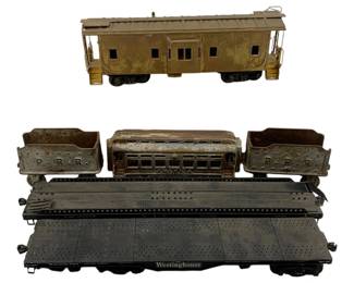 981 - 6pc. Lot Vintage Train Cars 14"x14"x2.5" (Description): A collection of six vintage train cars including a caboose, passenger car, coal tenders marked P.R.R., and flat cars including one marked Westinghouse and another marked NYC. The lot measures 14 inches by 14 inches by 2.5 inches.
