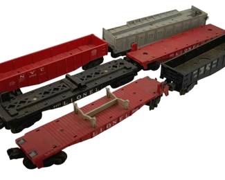505 - Lot O Scale Trains (Description): A lot of O scale trains. The collection includes various freight cars suitable for O gauge model railroad layouts.