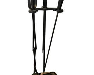 30 - Black Iron Fireplace Tool Set w/ Stand (Description): Black iron fireplace tool set with stand. This classic set includes a poker, tongs, and brush, all held in a coordinating stand with decorative egg-shaped finials. The stand features a rectangular base. Measures 30" x 11" x 7".