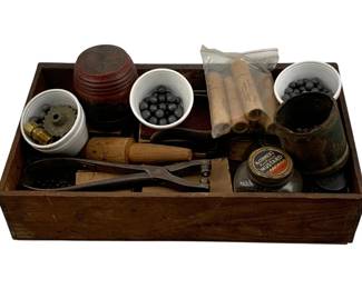 993 - Antique Gun Dies in Wood Box (Description): Lot of antique gun dies housed in a wood box. The collection includes various tools and components used for ammunition and firearm work. Box measures 3/8 x 15 x 2.5 inches.