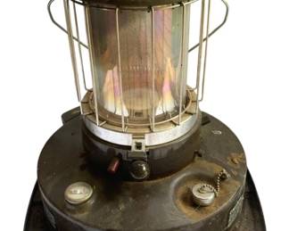 820 - Kero-Sun Moonlighter Kerosene Heater (Description): Kero-Sun Moonlighter portable kerosene heater featuring a cylindrical glass chimney surrounded by a protective metal cage with ventilated top. The brown base unit includes fuel gauge, ignition controls, and fill cap. Shows signs of use and age with some surface wear and residue, missing top. Measures 15 inches without top, 18 by 16 inches overall. Used as is electric/electronic/mechanical item. No guarantee all components, untested.