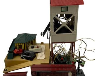 1023 - Lot Assorted Train Items (Description): A lot of assorted train items including various model railroad accessories and components.