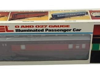 853 - Lionel Missouri Combo Car O Scale in Box (Description): Lionel Missouri Combo Car in O and 027 gauge, featuring illumination. This passenger car comes in its original Lionel box with product imagery showing the maroon/burgundy colored combo car design. The box indicates it is suitable for ages 8 to adult.