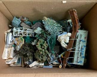 353 - Box Lot of Model Train Display Houses & Trees (Description): Box lot of model train display houses and trees. This assortment includes various miniature structures and foliage pieces suitable for model train layouts and dioramas.