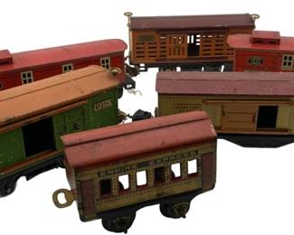 298 - Group Lot of 7 Lionel Train Cars 3"x3"x10" (Description): Group lot of seven Lionel train cars. The collection includes various vintage freight and passenger cars. Each car measures approximately 3 inches by 3 inches by 10 inches.