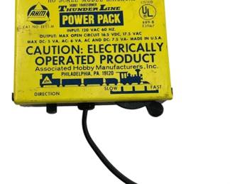 785 - AHM Thunderline Power Pack 1.5"x4.5"x4" (Description): AHM Thunderline Power Pack for HO scale model railroads. This hobby transformer is made by Associated Hobby Manufacturers, Inc. of Philadelphia, PA. Model 70203. Input: 120 VAC 60 Hz. Features direction control and speed adjustment from slow to fast. Made in USA. Measures 1 1/2" x 4 1/2" x 4". Used as is electric/electronic/mechanical item. No guarantee all components, untested.