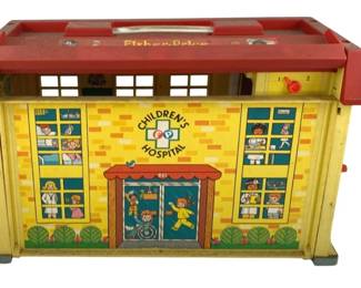 527 - Fisher Price Hospital 10"x13.5"x6" (Description): Fisher Price Children's Hospital toy. This vintage playset features the classic lithographed tin and plastic construction typical of Fisher Price toys. Measures 10 inches by 13.5 inches by 6 inches.