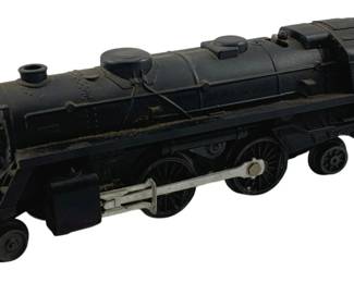 839 - Lionel #027 Locomotive 5.5"x9.5"x2.25" (Description): Lionel #027 locomotive in classic black finish, numbered 248 on the cab. This vintage O gauge steam engine features a detailed die-cast body with realistic detailing including dual smokestacks, bell, and white window inserts on the engineer's cab. The locomotive shows honest wear consistent with age and use. Measures 5.5" x 9.5" x 2.25".