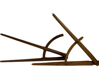1057 - 2pc. Lot Wood Compasses 28"x15" (Description): A lot of two wooden compasses. These antique measuring instruments feature traditional construction with pointed ends for drafting and measuring purposes. Measures 28 inches by 15 inches.